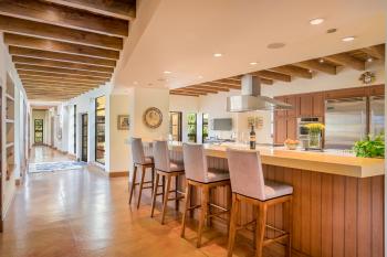 18595 Lomita Avenue Sonoma kitchen island with stools and long hallway